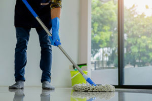man-mopping-floor